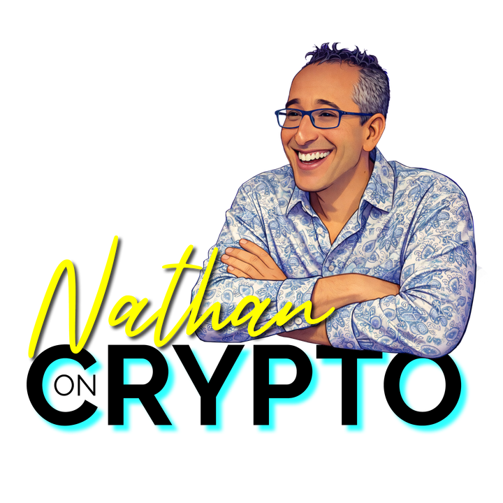 Nathan Jeffay, smiling, arms crossed, in a blue paisley shirt.